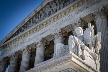 A summer day in front of the US Supreme Court Building in Washington, DC.