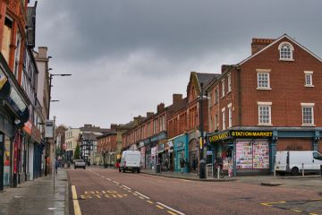A view of Wallgate in Wigan, Lancashire, England, UK. The railway station Wigan Wallgate is on this road, which leads down to the canal and building known as Wigan Pier.