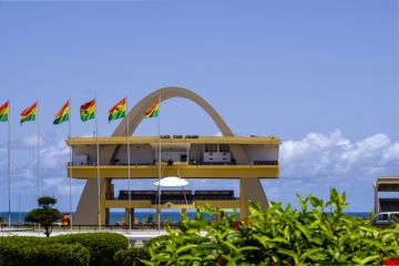 ACCRA,GHANA - APRIL 11 2018 Black Star Square. Independence Arch and flags of Ghana in Accra's Independence Square, site of Independence Day parades and national celebrations