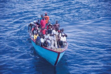 African people in overpacked boat