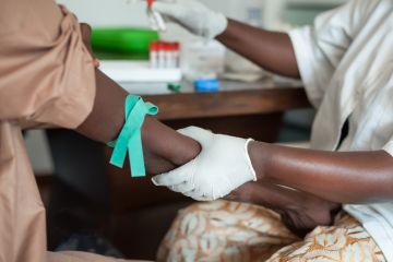 African nurse drawing blood African nurse drawing blood