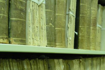 Aged medical journals on shelf Aged medical journals on shelf