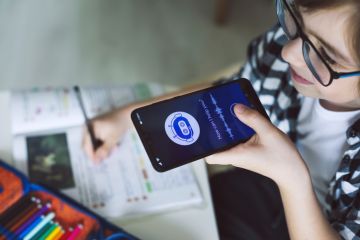 AI Chatbot Someone holding their phone to their mouth, talking into an AI chatbot