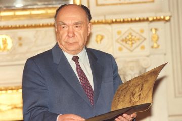 Alexander Yakovlev holding book Alexander Yakovlev holding book