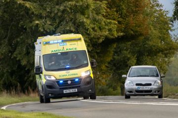 Ambulance overtakes a car