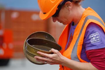An unidentified geologist inspects rock samples while drilling to 1300 metres on the Deep Fault Drilling Project, Whataroa, New Zealand An unidentified geologist inspects rock samples while drilling to 1300 metres on the Deep Fault Drilling Project, Whataroa, New Zealand
