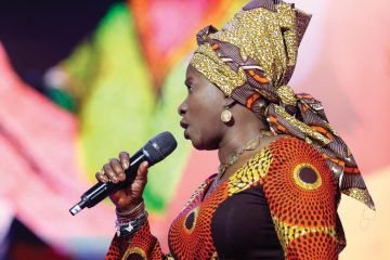 Angélique Kidjo singing on stage Angélique Kidjo singing on stage