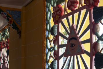 artistic decorations in a Caodai temple in Vietnam