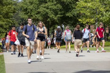 Athens, Georgia - August 27, 2021 Students walking on campus at the University of Georgia. As of the beginning of the Fall semester, the university was recommending but had not mandated the wearing of masks or vaccinations against COVID-19.