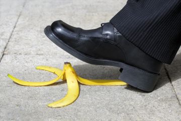 A suited man about to step on a banana peel, illustrating the threat to UK diplomacy posed by language department closures