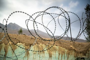 Barbed wire on the wall in Ishkashim, Afghanistan