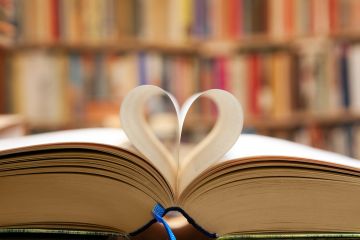 A book with its pages folded into a heart shape A book with its pages folded into a heart shape, symbolising publc support for universities