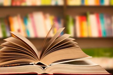 Books open on table Books open on table