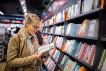 woman reading in a bookshop