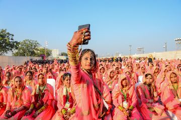 A Muslim bride takes a selfie with her mobile phone as she participates in an ‘All Religion Mass Wedding’ ceremony at Sabarmati Riverfront in Ahmedabad, India on 8 February 2020. A Muslim bride takes a selfie with her mobile phone as she participates in an ‘All Religion Mass Wedding’ ceremony at Sabarmati Riverfront in Ahmedabad, India on 8 February 2020.