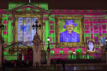 Buckingham Palace projection shows the portrait of Queen Elizabeth and self-portraits of young people in the art project Face Britain on April 21, 2012 in London