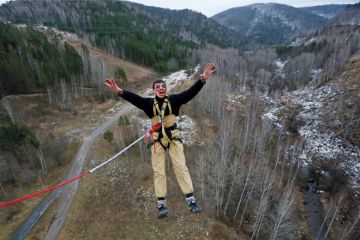 Bungee jumper yelling while leaping Bungee jumper yelling while leaping