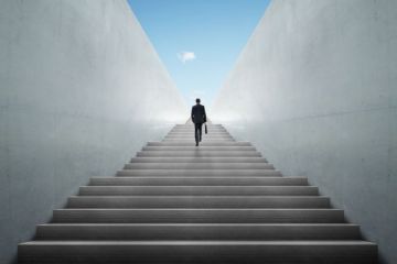 Businessman climbing stairs Businessman climbing stairs