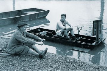 Canoeist being taught rowing seating position Canoeist being taught rowing seating position