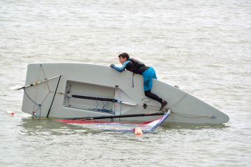 Capsized Sailing Dinghy
