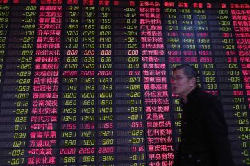 Chinese man by currency exchange board