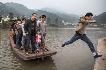 Man leaps from boat, China Man leaps from boat, China