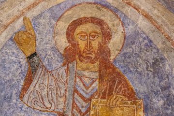 Christ pantoctator lifting his hand with a copper bracelet, in a blessing gesture, Övraby, Sweden, November 6, 2009