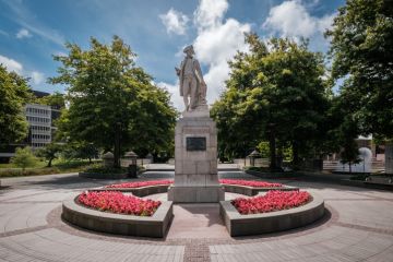 Christchurch, New Zealand - December 25th 2022 A statue of the explorer James Cook stands in Victoria Square in Christchurch, New Zealand. Cook was the first man to circumnavigate New Zealand in 1769