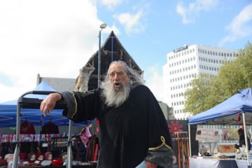 Christchurch, New Zealand, October 12, 2019 The wizard of Christchurch speaks in Cathedral Square to a crowd of tourists and spectators.