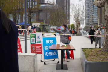 City Nantong in Jiangsu province in China, March 31 2022 government doing mass Covid-19 testing for Omicron. People line up for the registration and test