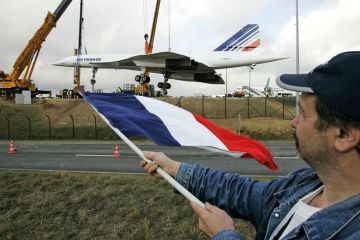 Concorde enthusiast waves French flag Concorde enthusiast waves French flag