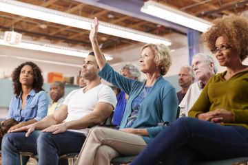 An audience member asks a question at a conference