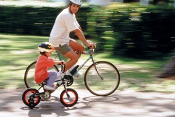 Father and son riding bicycles Father and son riding bicycles