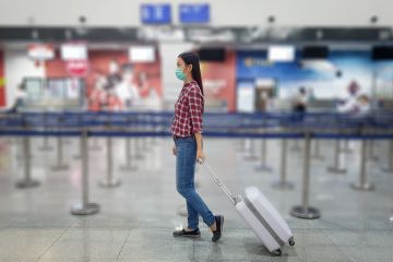 A Chinese tourist wears a surgical mask