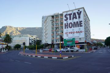 a building with a coronavirus lockdown sign in Cape Town