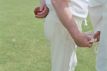 Cricket player and umpire exchanging bribe Cricket player and umpire exchanging bribe