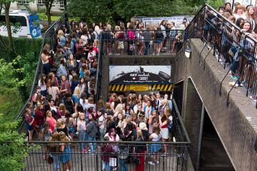 Crowd of fans queueing for a gig on stairs at Cardiff University, illustrating the university's plans to increase the staff-student ratio. Crowd of fans queueing for a gig on stairs at Cardiff University, illustrating the university's plans to increase the staff-student ratio.
