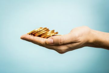 hand holding coins