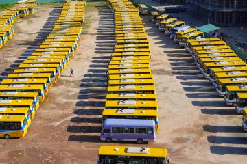Da Nang, Vietnam - Feb 11, 2020 Aerial view of local buses at a spacious parking zone under Thuan Phuoc bridge during Tet - Vietnamese lunar new year.