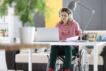 A disabled student working at home