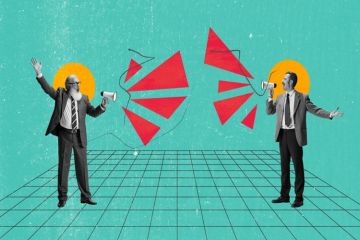 Two people shout at each other through megaphones Two people shout at each other through megaphones