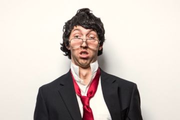 A dishevelled man in a suit