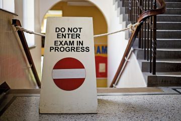 'Do not enter. Exam in progress' sign on staircase 'Do not enter. Exam in progress' sign on staircase