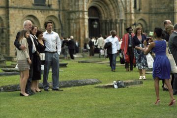 Durham England - July 1, 2011 Plenty of people convey in front of the Cathedral (Palace Green) to celebrate the graduations of the School of Engineering of the University of Durham.