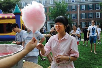 Female student buying cotton candy, Yale Summer School Female student buying cotton candy, Yale Summer School