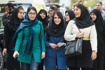Female students walking on campus, University of Tehran, Iran Female students walking on campus, University of Tehran, Iran