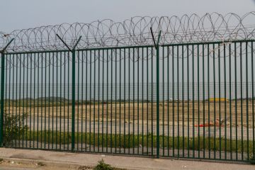 Fence with razor wire guarding French ferry terminal