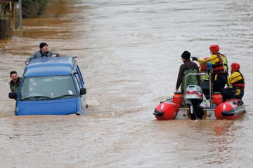 Firemen rescuing men in sinking van, Gloucester, England, 2012 Firemen rescuing men in sinking van, Gloucester, England, 2012
