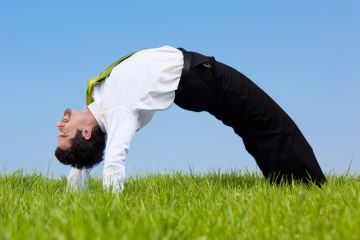 Flexible businessman bending over backwards Flexible businessman bending over backwards
