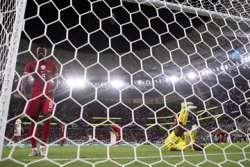 Mohammed Muntari and Meshaal Barsham of Qatar react during a FIFA World Cup Qatar 2022 match between Qatar and Senegal 